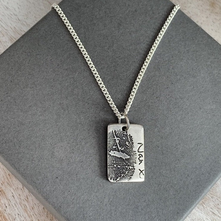 Made with an ink print and engraved with loved one's own handwriting.